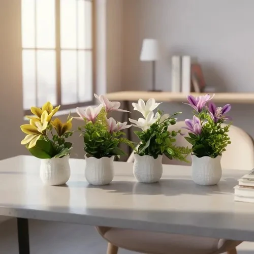 Small artificial flowers in a white ribbed vase-shaped pot