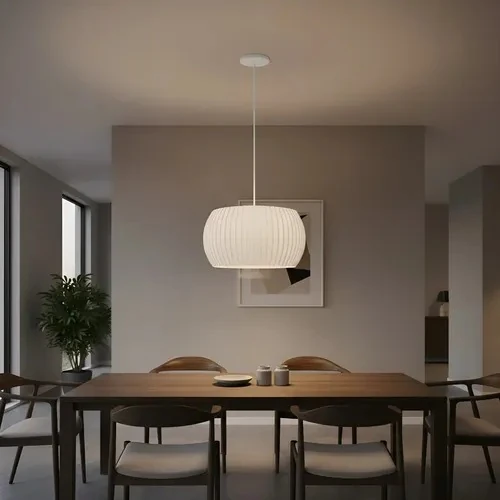 White pleated pendant lamp shaped like a wide flattened sphere, 30 cm across
