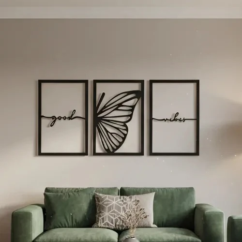 Black metal laser-cut triptych: 'good', butterfly and 'vibes' in three frames