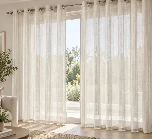 Pair of floor-length natural linen-look sheer curtains with metal grommets
