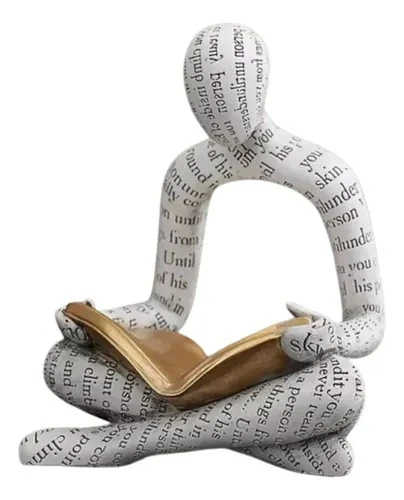 Seated cross-legged reader figurine covered in printed text, holding a gold book
