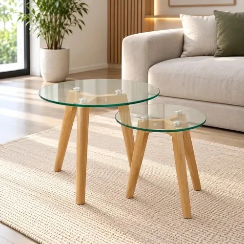 Pair of nesting round glass-top coffee tables on tapered natural-wood legs