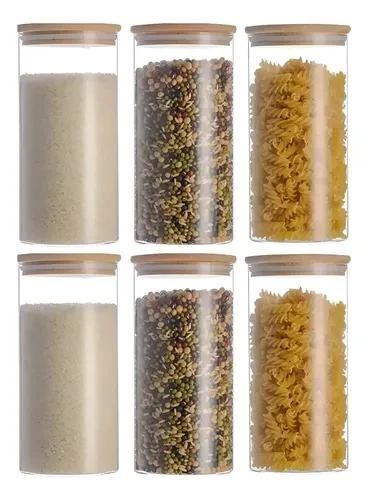 Set of six tall clear glass storage jars with bamboo lids